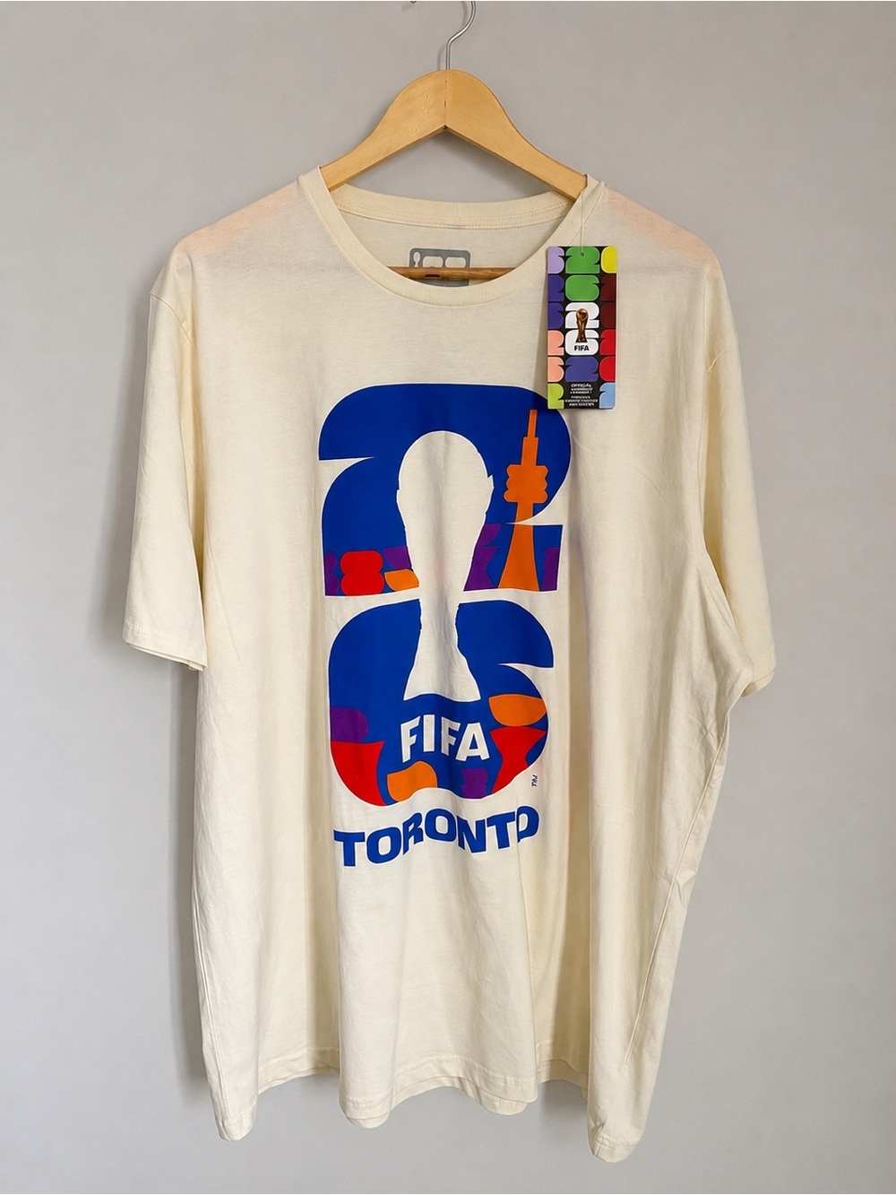 FIFA Toronto Graphic Tee - Cream with Blue Print